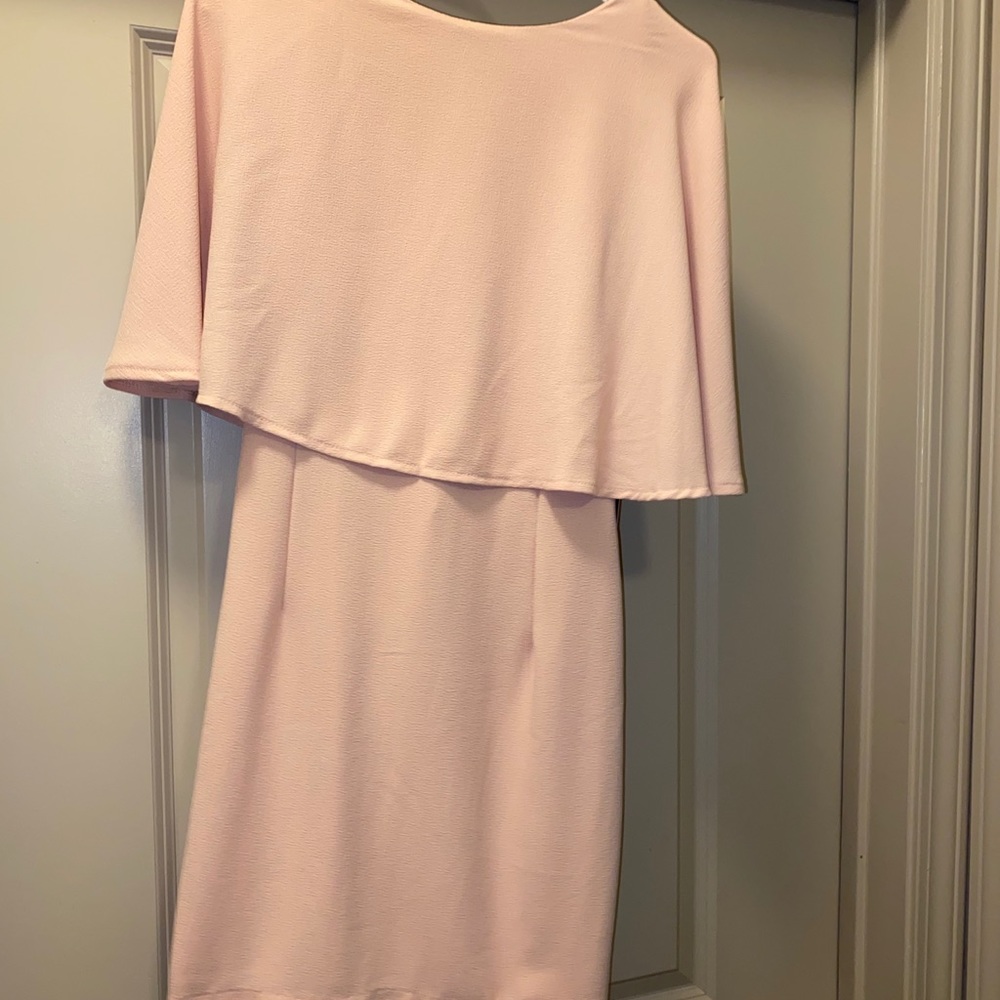 Cocktail dress has a beautiful cape and low back